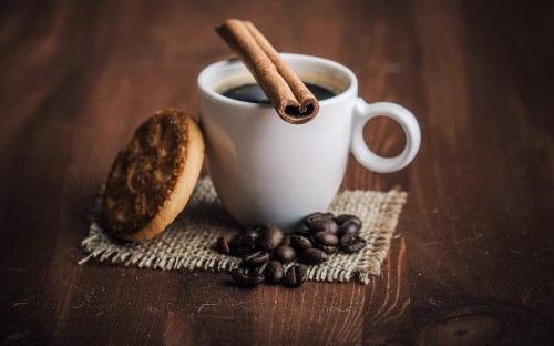 Image white ceramic mug with coffee beans