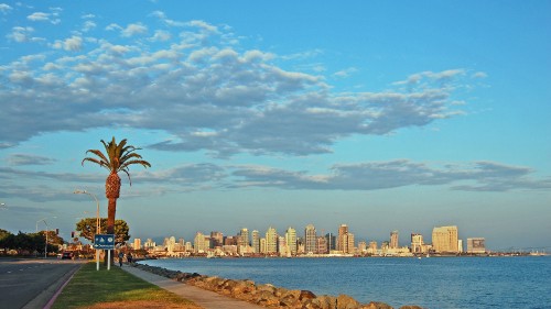 Image city skyline under blue sky and white clouds during daytime