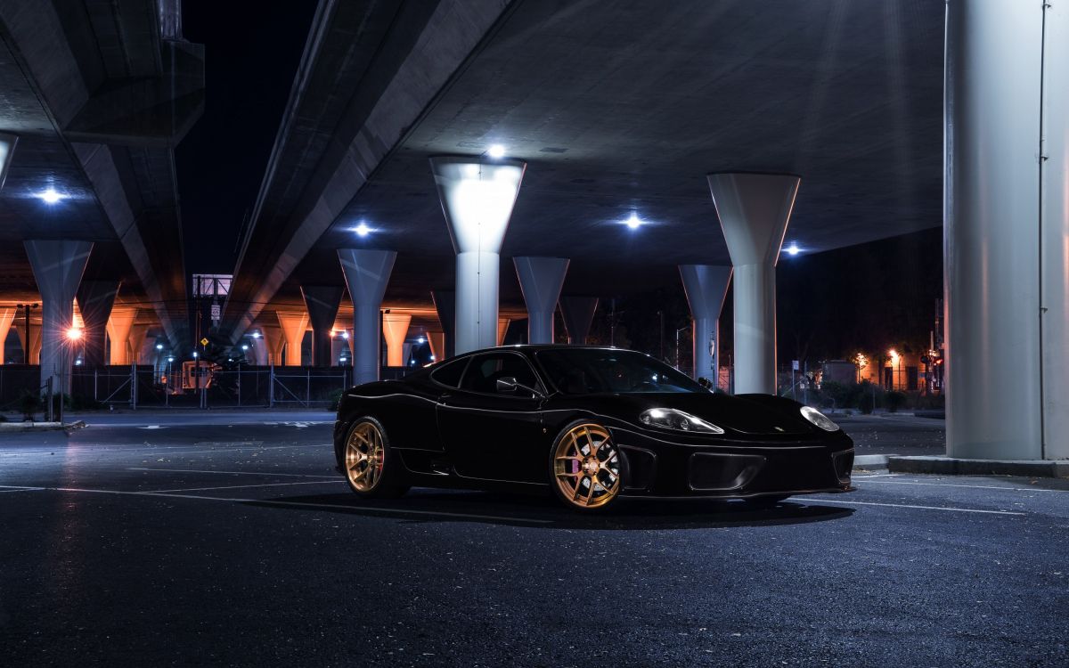 black porsche 911 parked on parking lot