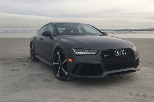 Image black audi coupe on gray sand during daytime