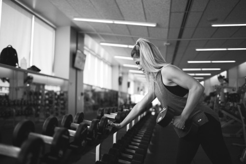 Image woman in black tank top doing exercise