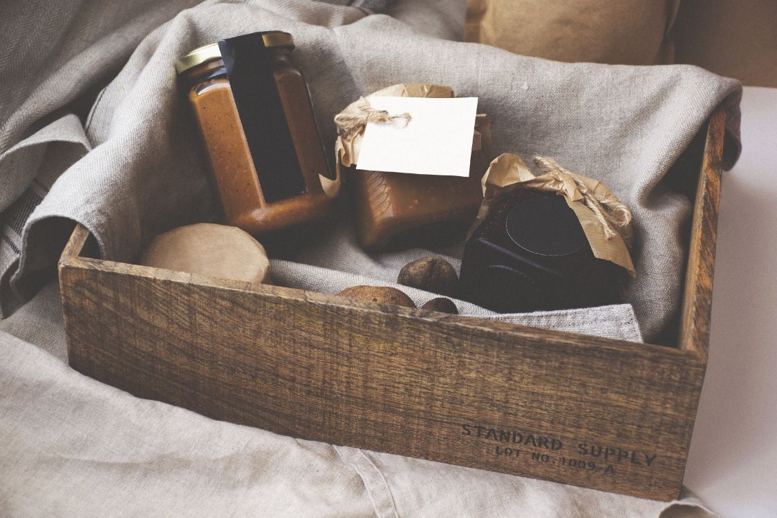 brown and white box on white textile