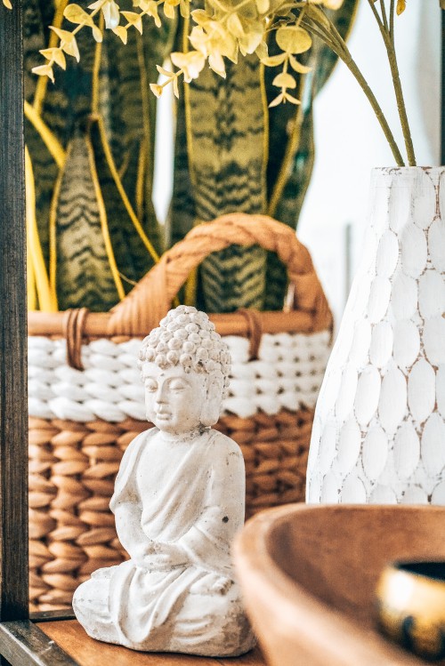 Image angel ceramic figurine on brown woven basket