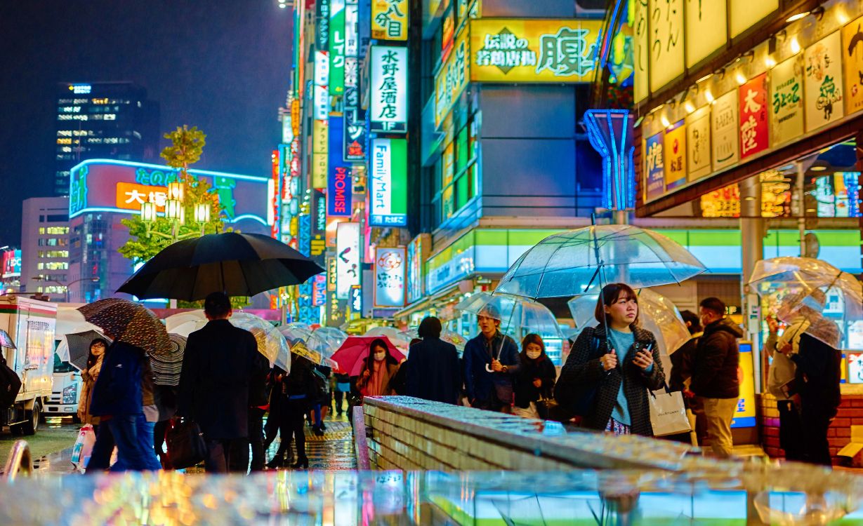 people walking on street during night time