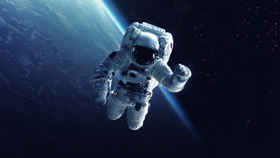 Image person in white and blue suit with goggles