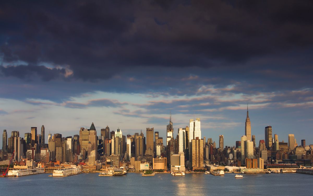 city skyline across body of water during daytime