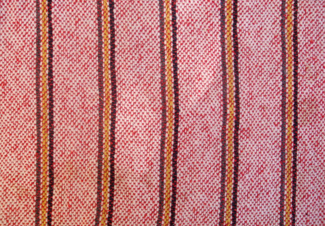 red and brown striped textile