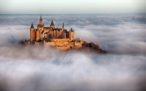 Image brown castle on top of mountain