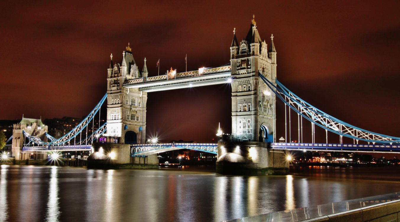 white and brown concrete bridge during night time