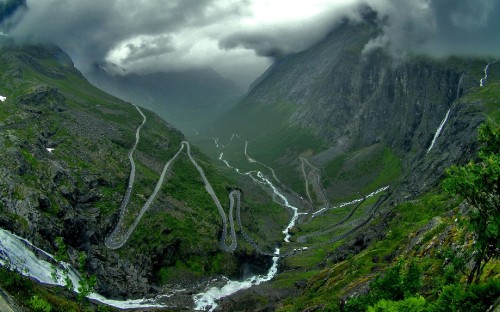 Image river between green mountains under white clouds during daytime