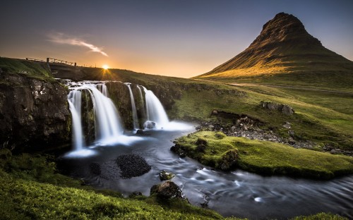 Image waterfalls on green grass field during daytime