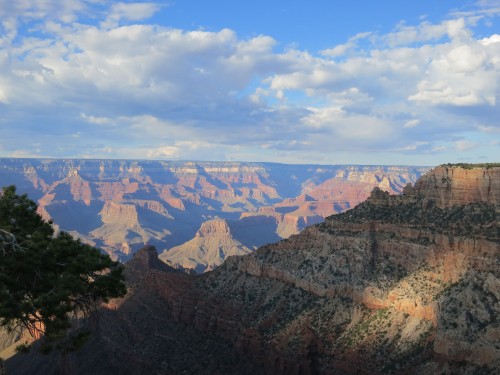 Image brown and gray mountains under white clouds and blue sky during daytime