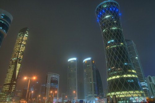 Image blue lighted high rise building during night time