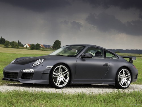 Image black porsche 911 on road under blue sky