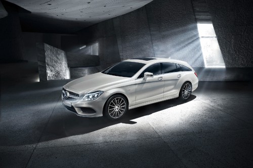 Image silver mercedes benz coupe parked beside gray concrete wall