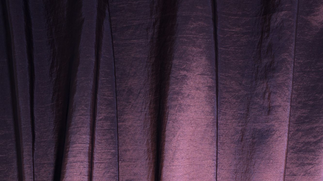 purple textile near black textile