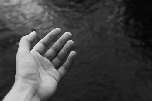 Image grayscale photo of persons hand