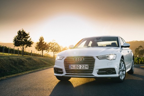 Image white audi a 4 on road during daytime