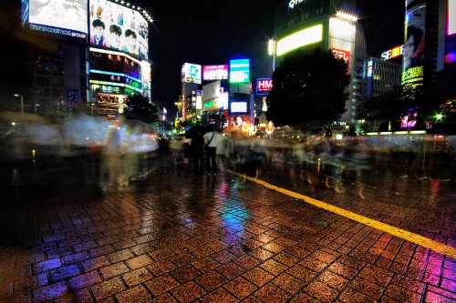 Image people walking on sidewalk during night time