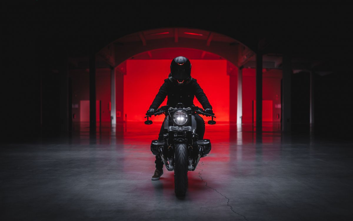 man in black motorcycle helmet riding motorcycle