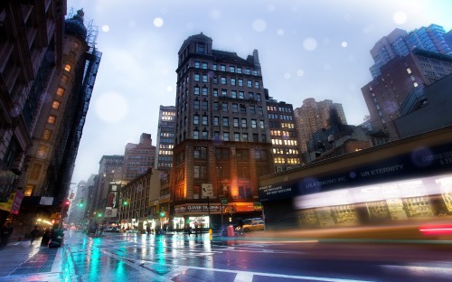 Image city buildings with lights turned on during night time