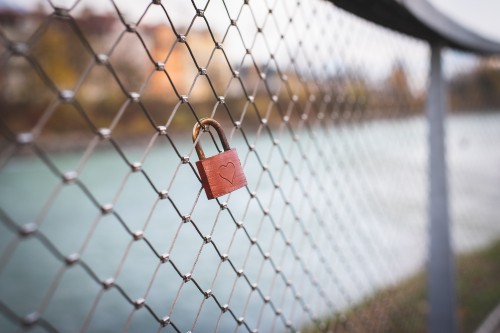 Image padlock on chain link fence