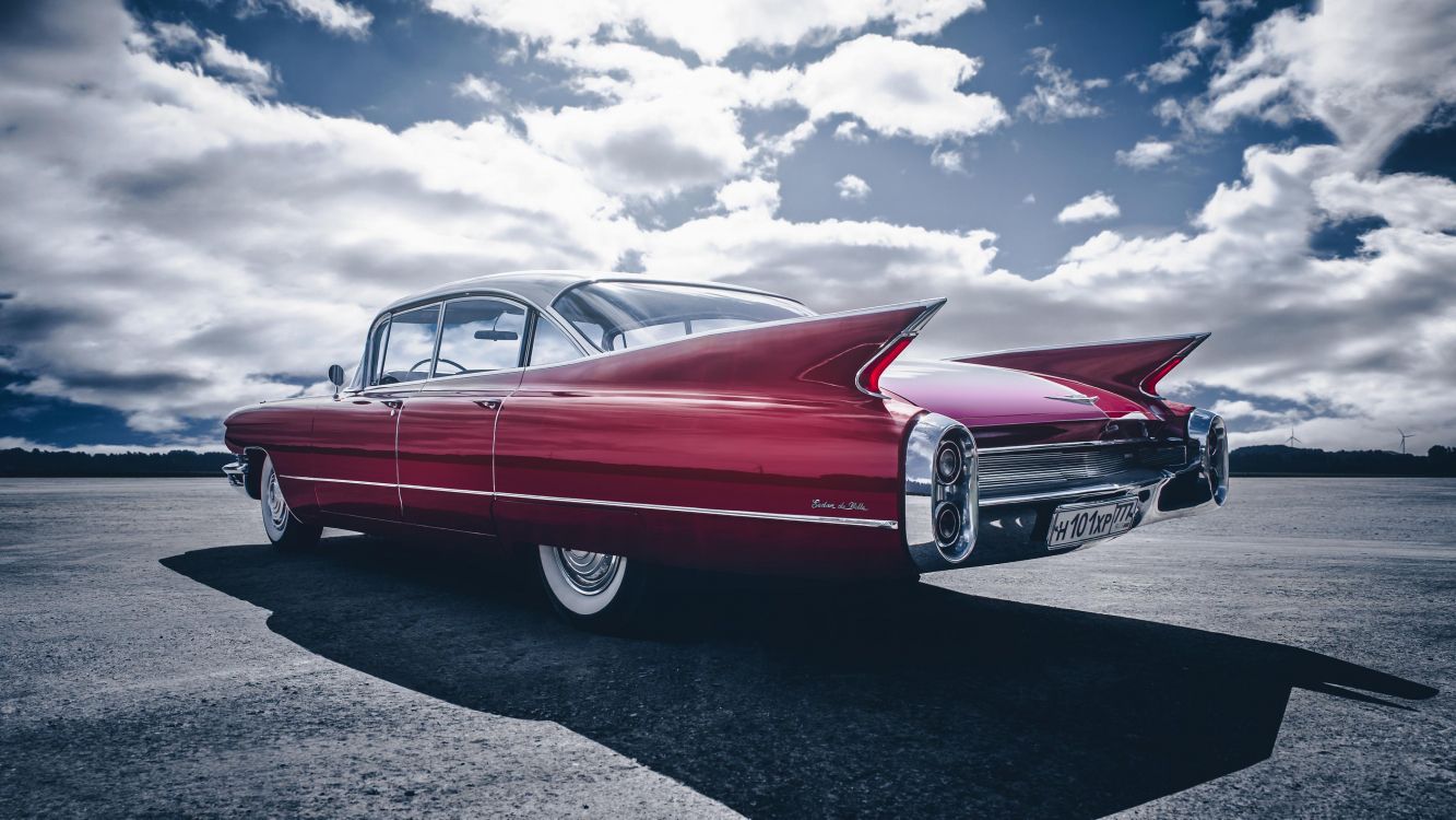 red mercedes benz coupe on gray asphalt road under blue and white sunny cloudy sky during