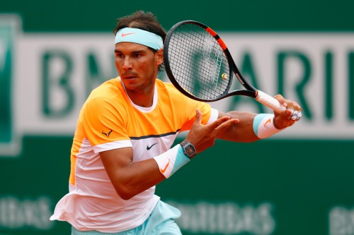 Image man in yellow shirt playing tennis