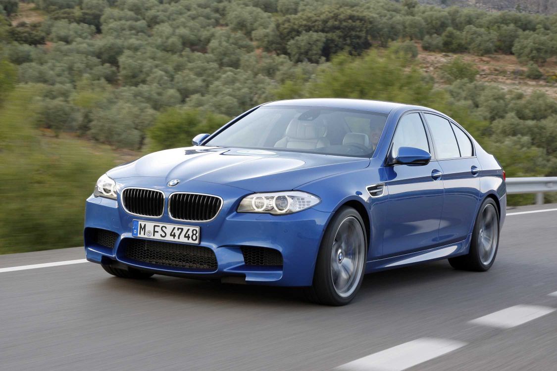 blue bmw m 3 coupe on road during daytime