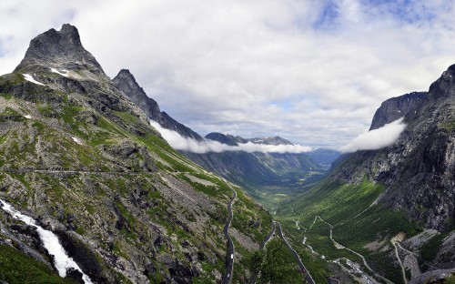 Image green mountains under white clouds during daytime