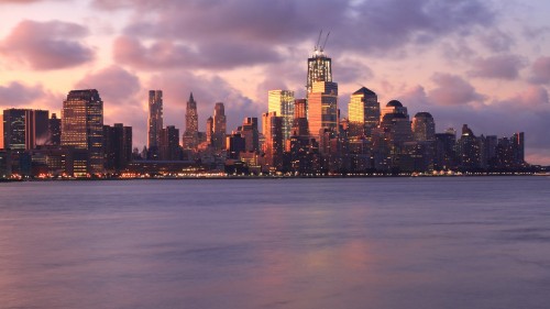 Image city skyline under gray cloudy sky during daytime