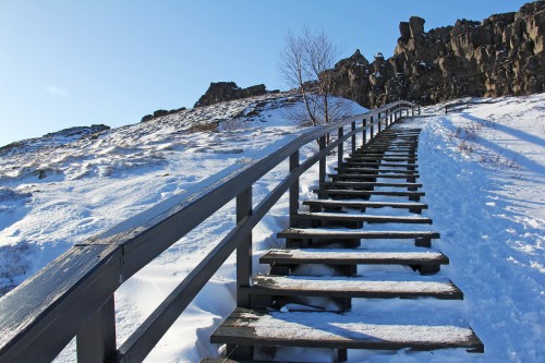 Image brown wooden staircase covered with snow