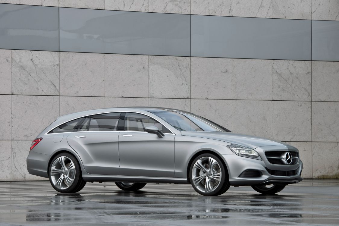Silver Mercedes Benz Coupe Parked Beside Brown Wall. Wallpaper in 3000x2000 Resolution