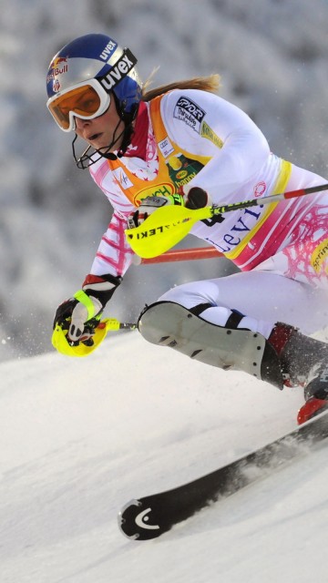 Image person in white and pink jacket riding on white snow board during daytime