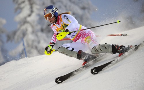 Image person in white and pink jacket riding on white snow board during daytime