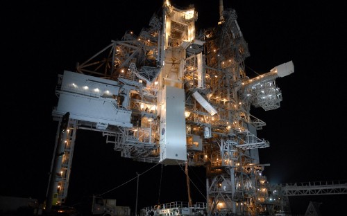 Image white and brown metal tower during night time