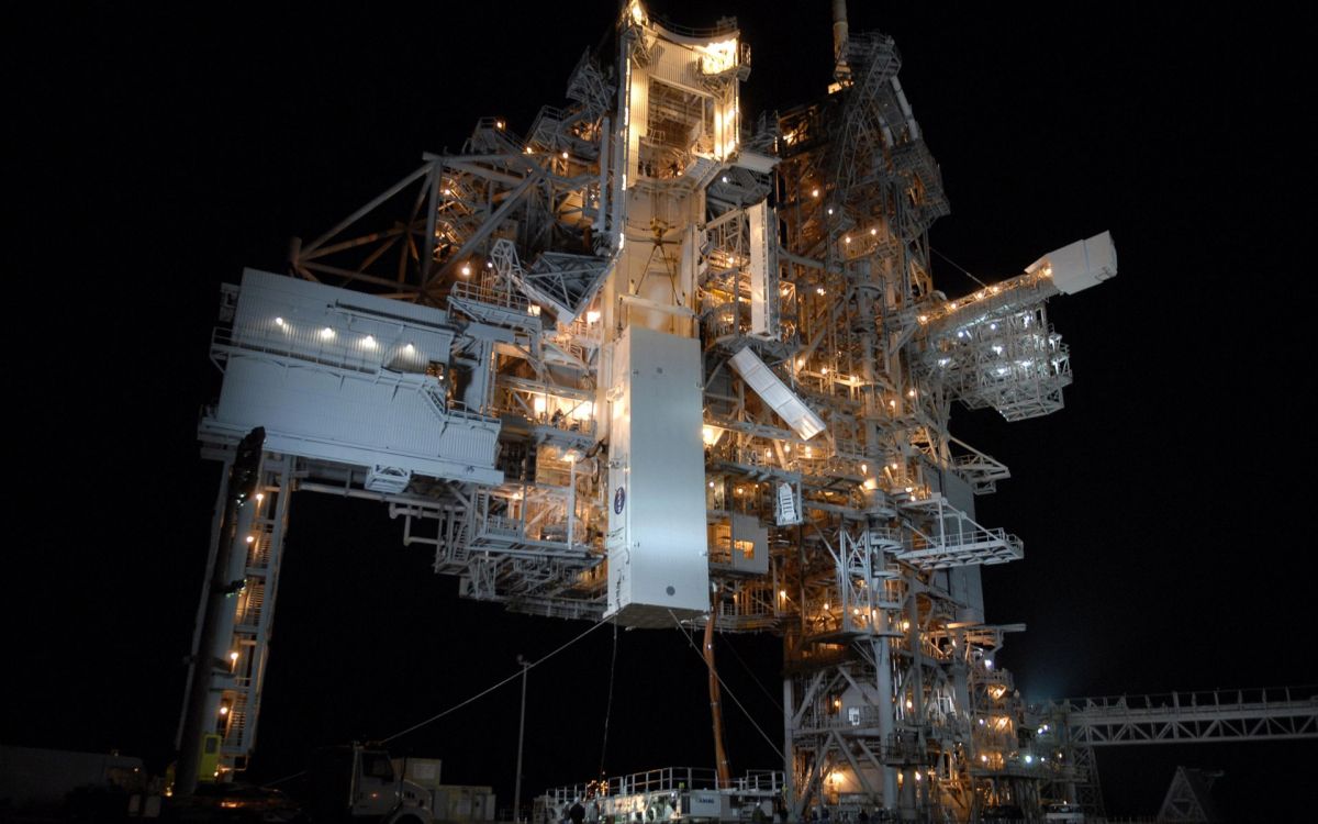 white and brown metal tower during night time