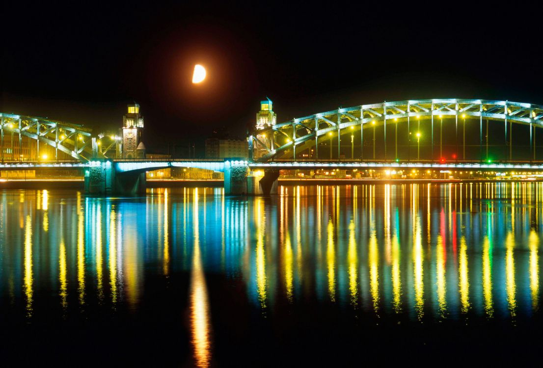 Beleuchtete Brücke Über Wasser Während Der Nacht Night. Wallpaper in 3000x2033 Resolution