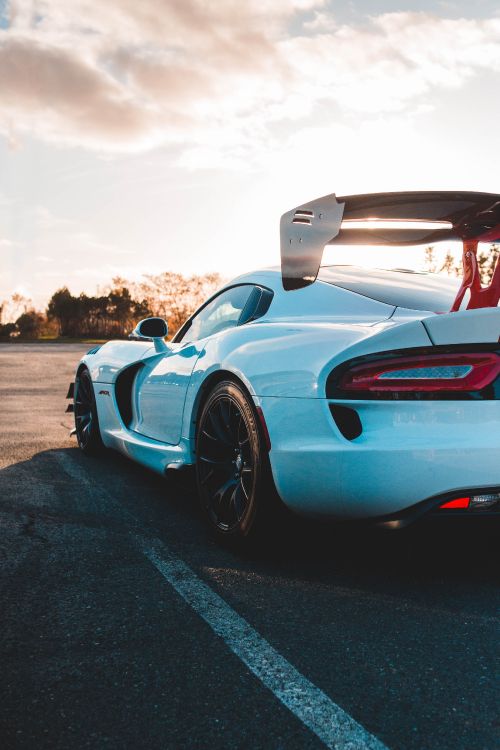 blue and black sports car on road during daytime