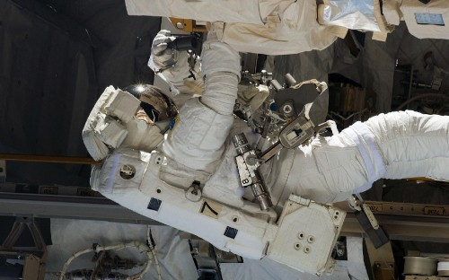 Image person in white shirt and pants wearing helmet