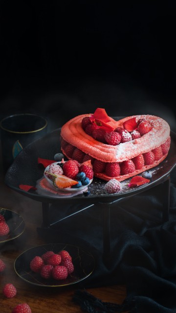 Image red and white heart shaped cake on tray