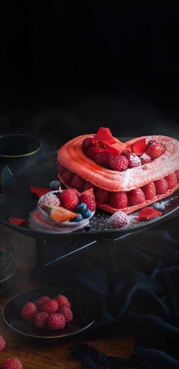 Image red and white heart shaped cake on tray