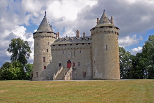 Image brown concrete castle under white sky during daytime