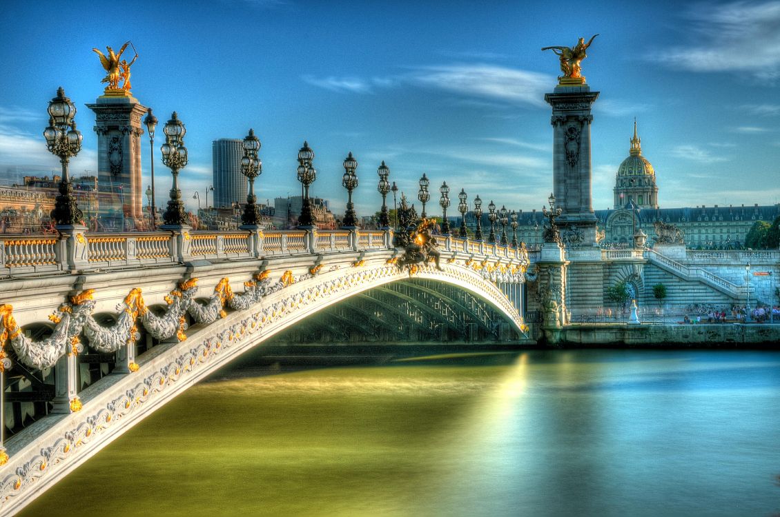 white concrete bridge over river during daytime