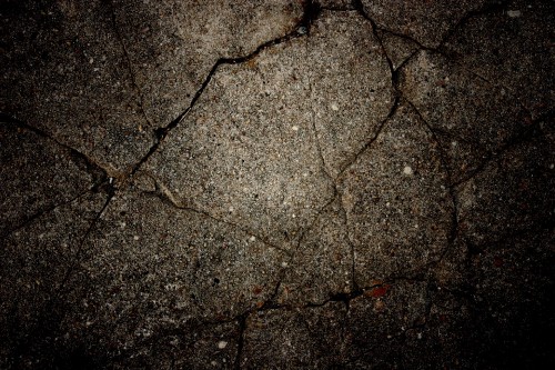 Image brown dried leaves on gray concrete floor