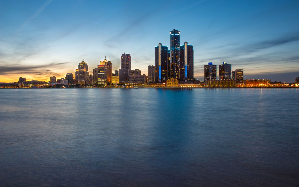 city skyline across body of water during daytime