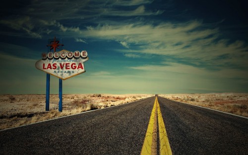 Image yellow and blue road sign under blue sky