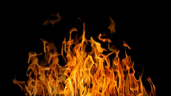 Image fire in black background with black background