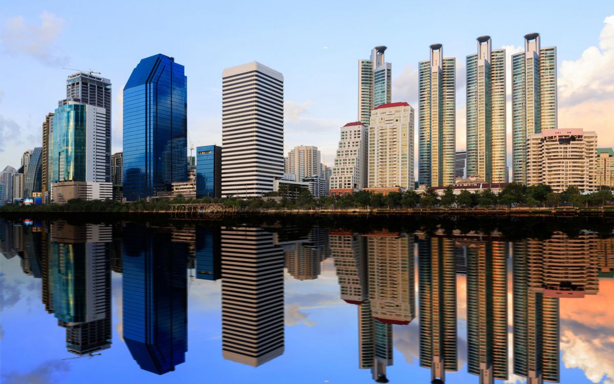 high rise buildings near body of water during daytime