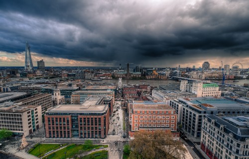 Image brown and gray concrete building under gray clouds